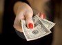 woman-hand-giving-money-thumb